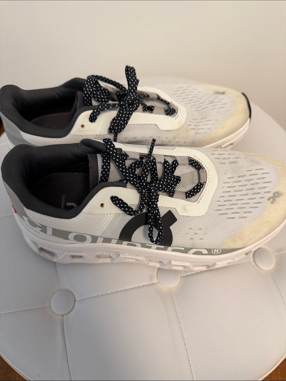 On Running Kids Sneakers in White and Black with Subtle Yellow Tint